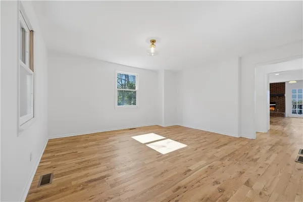 a view of a house with yard and sitting area