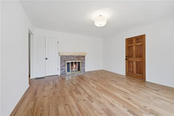 a kitchen with a sink appliances and cabinets