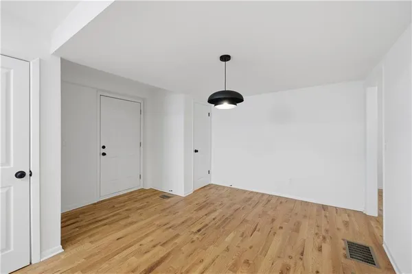 a kitchen with a center island and stainless steel appliances