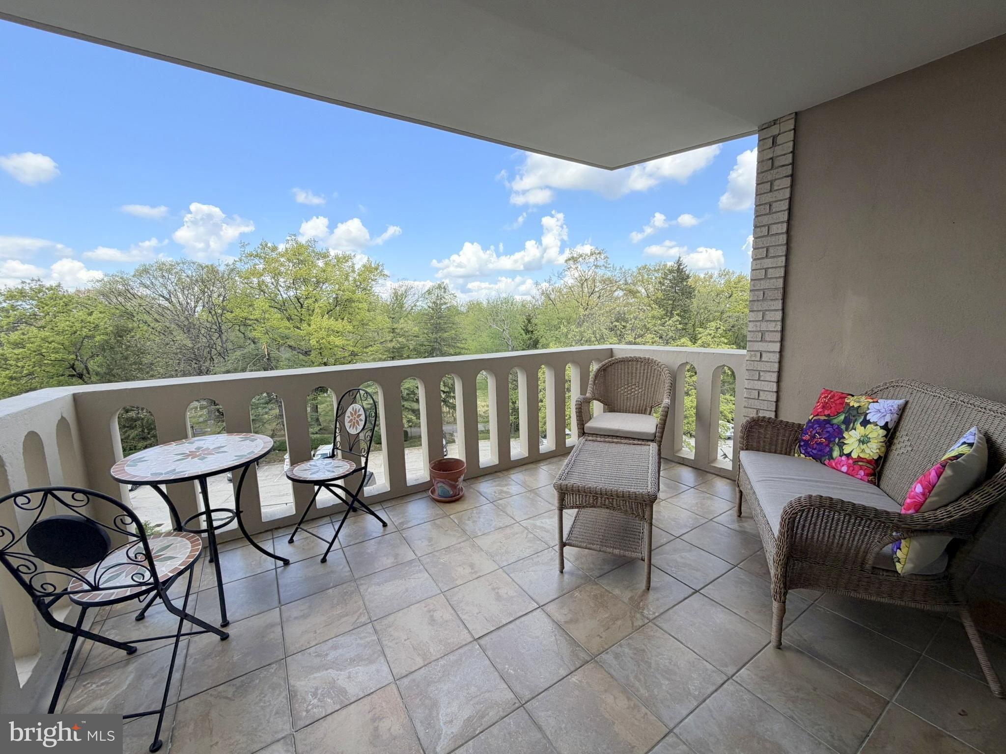 191 Presidential Boulevard, Unit R403 Bala Cynwyd, PA 19004 - Photo 11 of 30 a roof deck with a couple of chairs and a potted plant