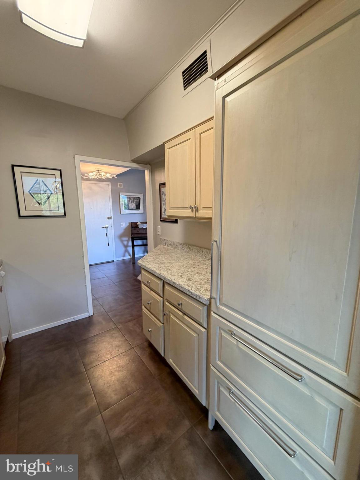 191 Presidential Boulevard, Unit R403 Bala Cynwyd, PA 19004 - Photo 18 of 30 a kitchen with stainless steel appliances granite countertop a sink and a refrigerator