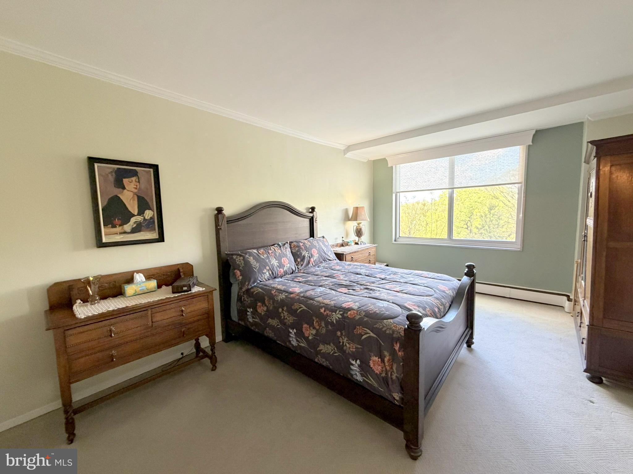 191 Presidential Boulevard, Unit R403 Bala Cynwyd, PA 19004 - Photo 22 of 30 a bedroom with a bed dresser and window