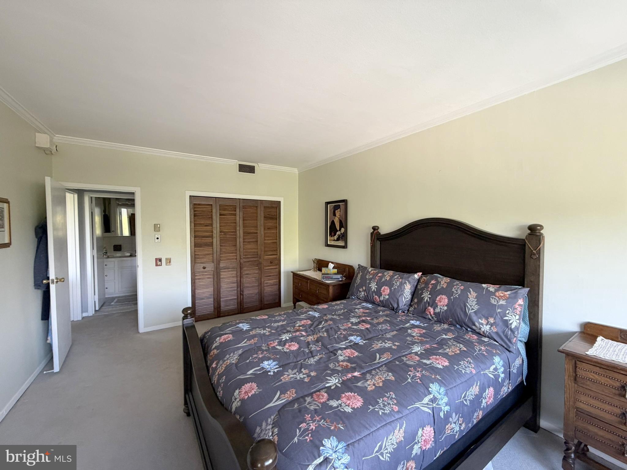 191 Presidential Boulevard, Unit R403 Bala Cynwyd, PA 19004 - Photo 23 of 30 a bedroom with a large bed and a chair