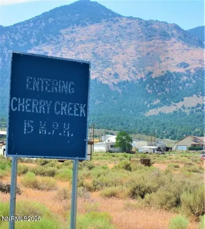 a sign that is sitting on a brick wall