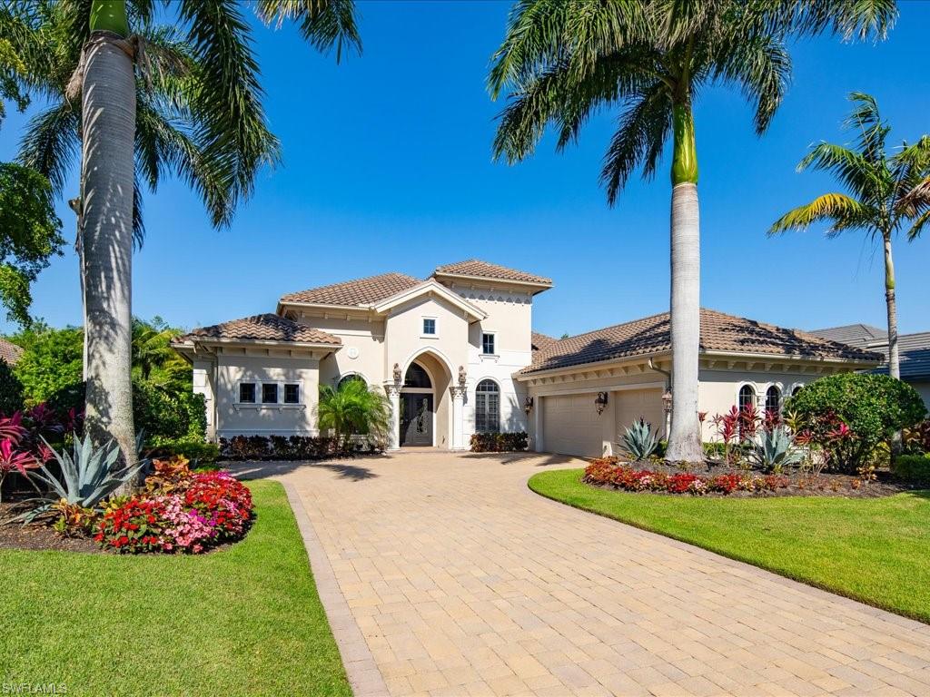 a front view of multiple houses with yard