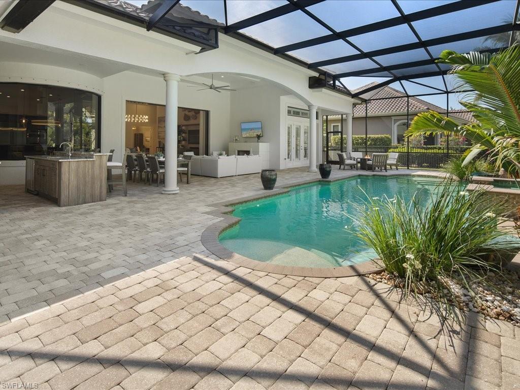 4249 Deephaven Lane Naples, FL 34119 - Photo 18 of 50 a view of a backyard with a patio