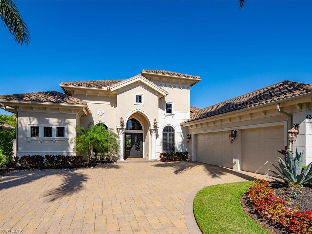 4249 Deephaven Lane Naples, FL 34119 - Photo 2 of 50 a front view of a house with a yard