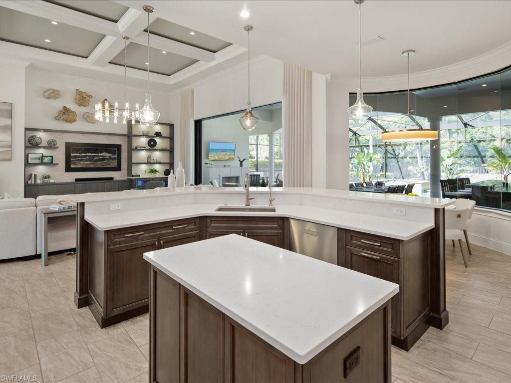 4249 Deephaven Lane Naples, FL 34119 - Photo 27 of 50 a kitchen with a stove a sink and a refrigerator