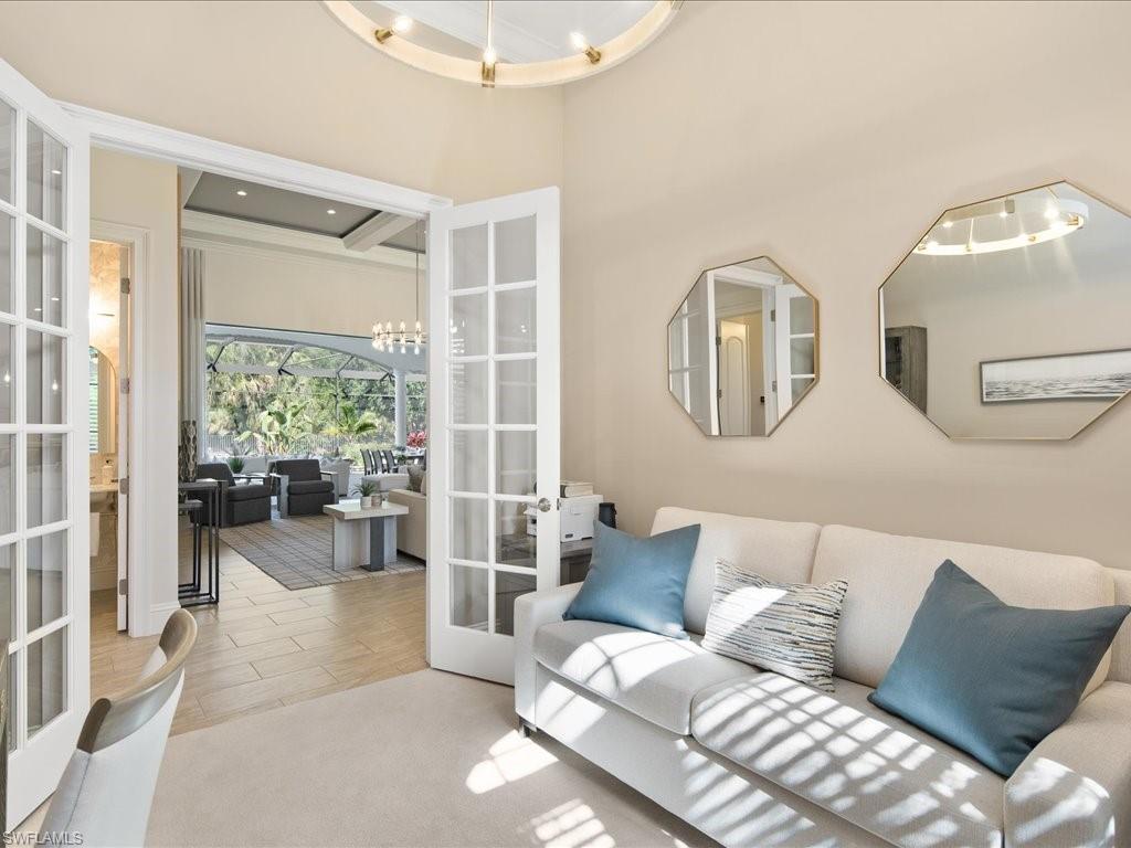 4249 Deephaven Lane Naples, FL 34119 - Photo 31 of 50 a living room with furniture and a large window