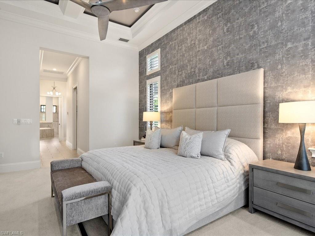 4249 Deephaven Lane Naples, FL 34119 - Photo 32 of 50 a bedroom with a bed and a couch