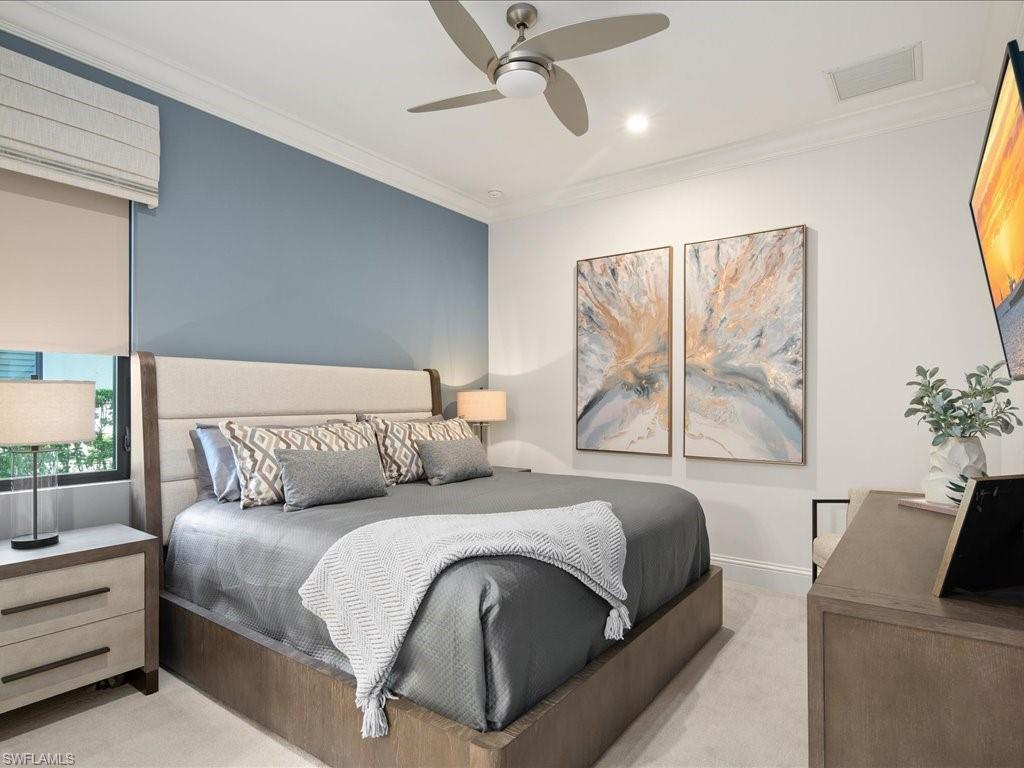 4249 Deephaven Lane Naples, FL 34119 - Photo 37 of 50 a bedroom with a large bed and a couch