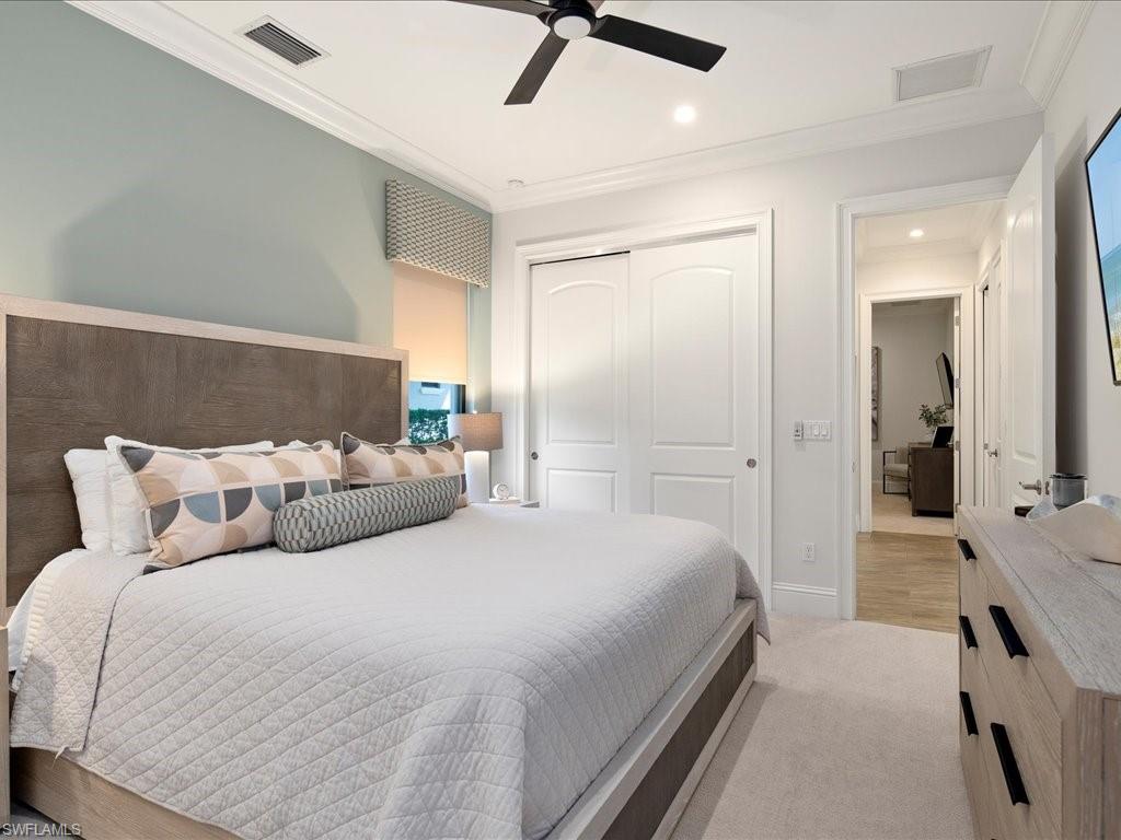 4249 Deephaven Lane Naples, FL 34119 - Photo 40 of 50 a bedroom with a bed and painting on the wall