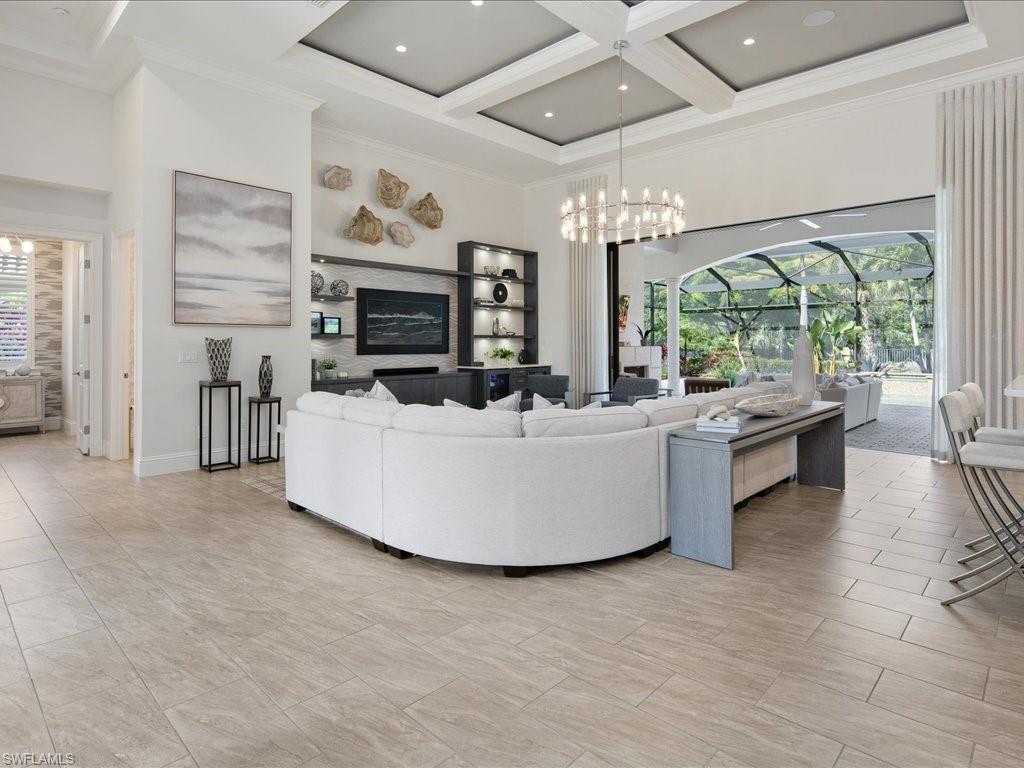 4249 Deephaven Lane Naples, FL 34119 - Photo 4 of 50 a living room with furniture fireplace and flat screen tv