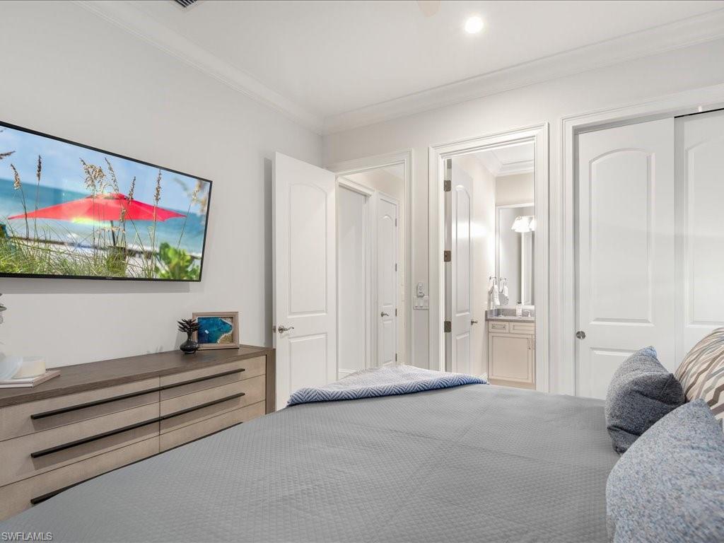 4249 Deephaven Lane Naples, FL 34119 - Photo 42 of 50 a living room with furniture and a potted plant
