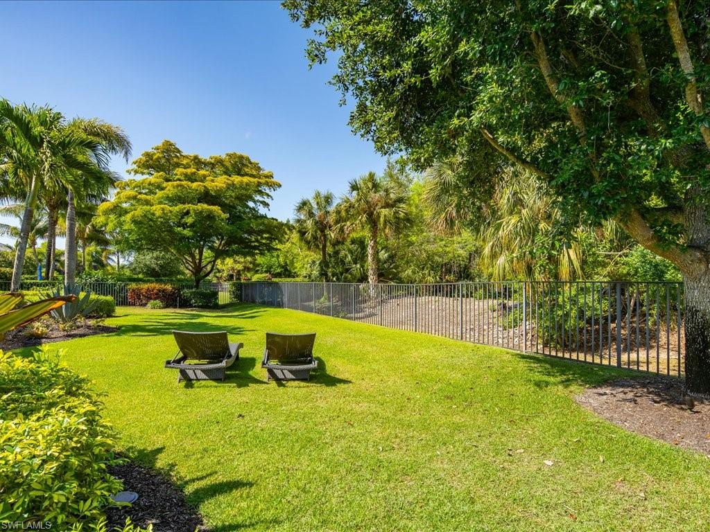 4249 Deephaven Lane Naples, FL 34119 - Photo 49 of 50 a view of a swimming pool with a garden