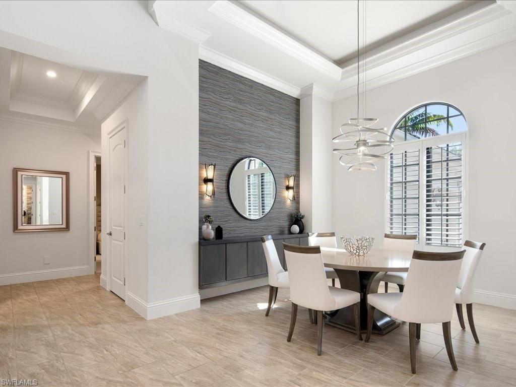 4249 Deephaven Lane Naples, FL 34119 - Photo 9 of 50 a view of a a dining room with furniture window and wooden floor