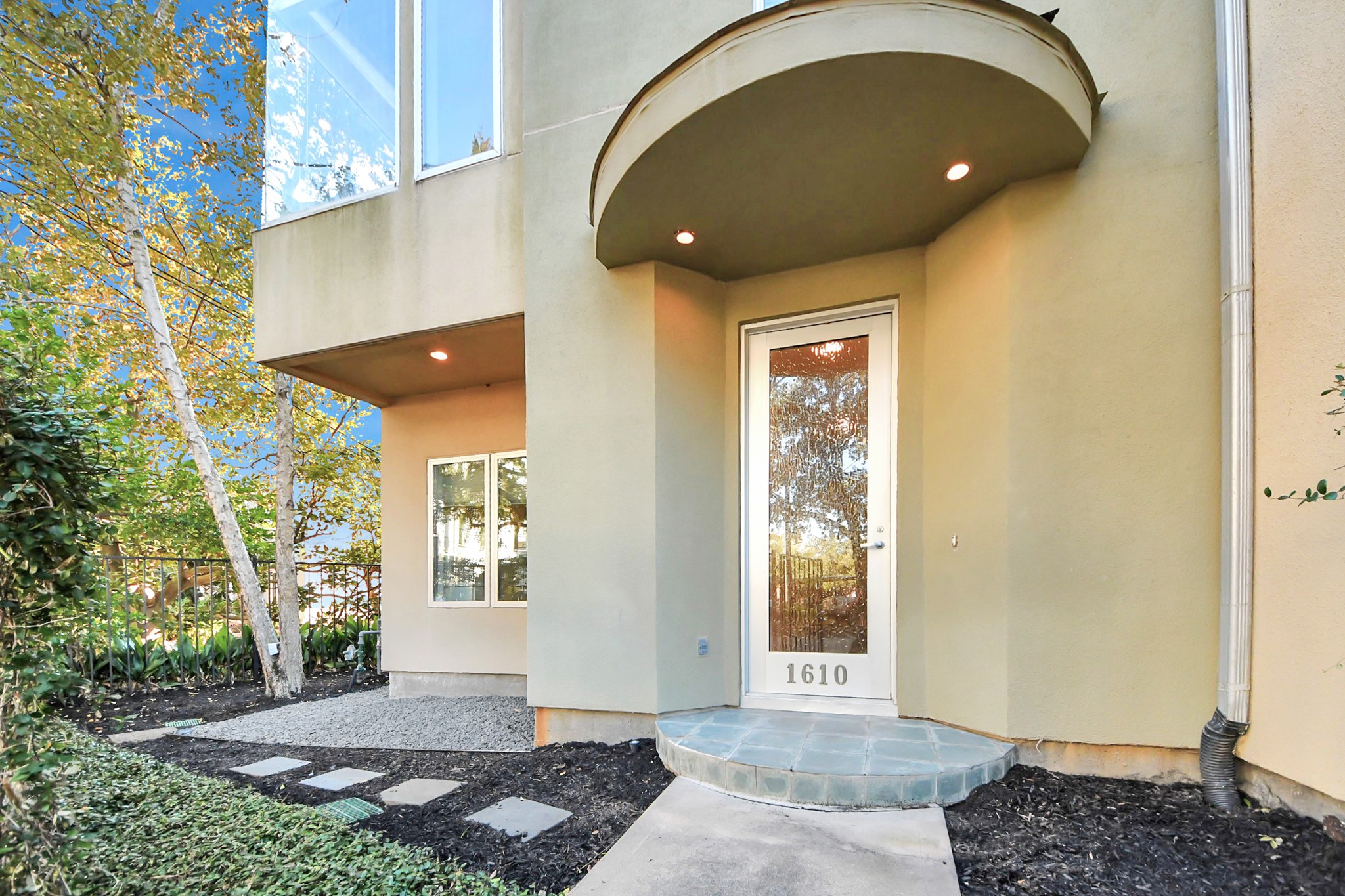 a view of entryway with a front door and wooden floor