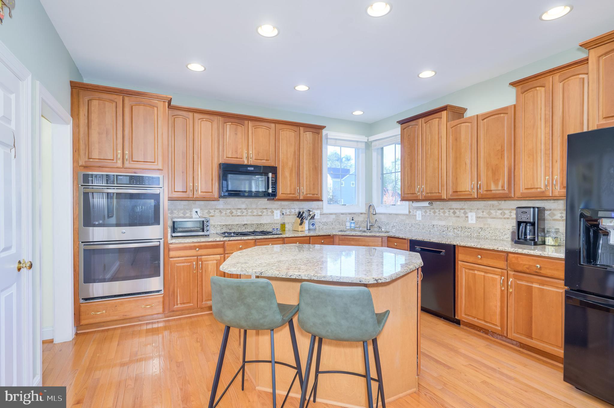 109 Amalfi Court Purcellville, VA 20132 - Photo 14 of 65 a kitchen with granite countertop a sink counter space cabinets and stainless steel appliances