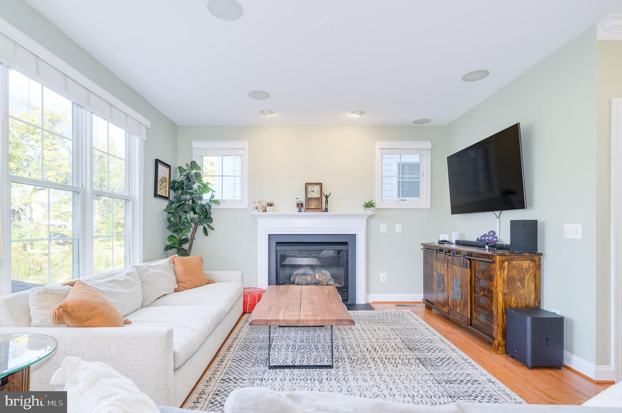 109 Amalfi Court Purcellville, VA 20132 - Photo 21 of 65 a living room with furniture and a fireplace