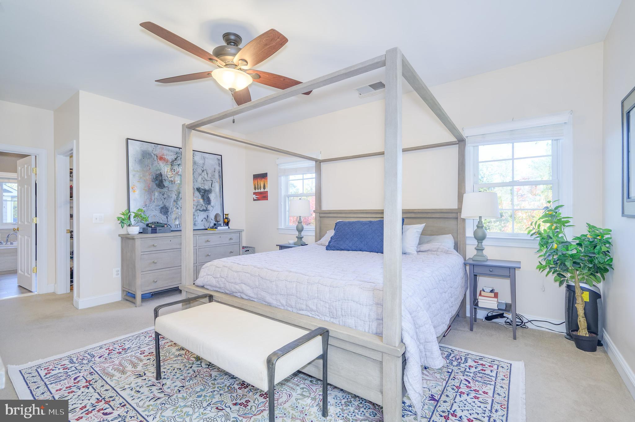 109 Amalfi Court Purcellville, VA 20132 - Photo 25 of 65 a living room with furniture a potted plant and a large window