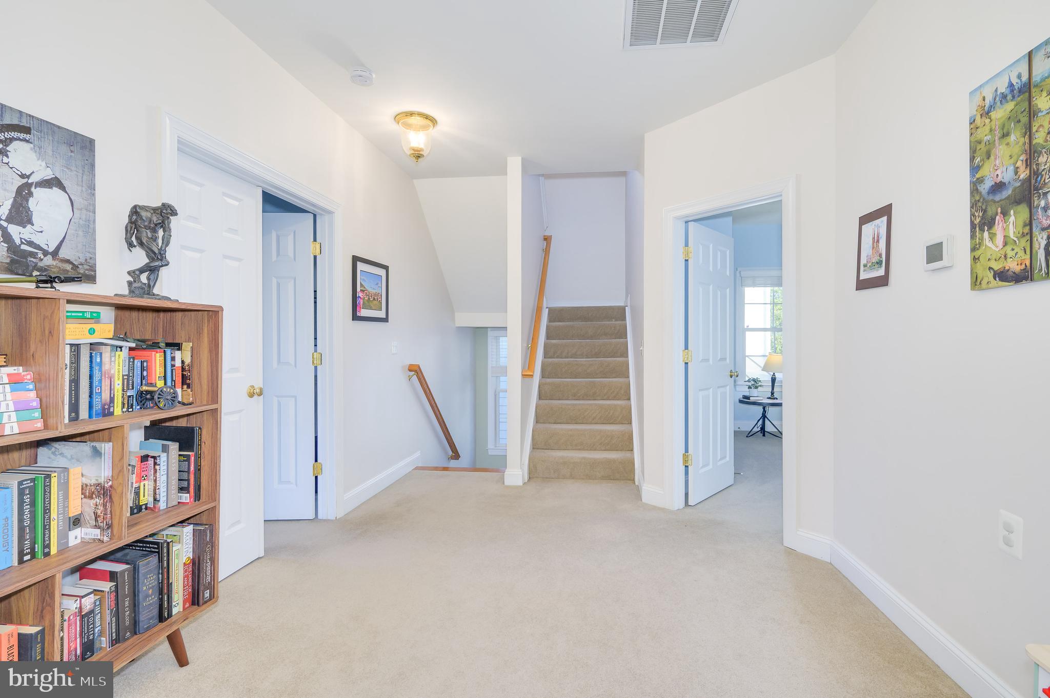 109 Amalfi Court Purcellville, VA 20132 - Photo 39 of 65 a view of an empty room with bookshelf and a window