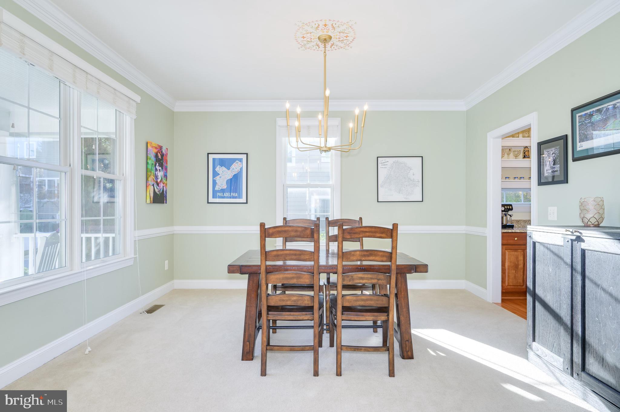 109 Amalfi Court Purcellville, VA 20132 - Photo 6 of 65 a view of a dining room with furniture window and wooden floor
