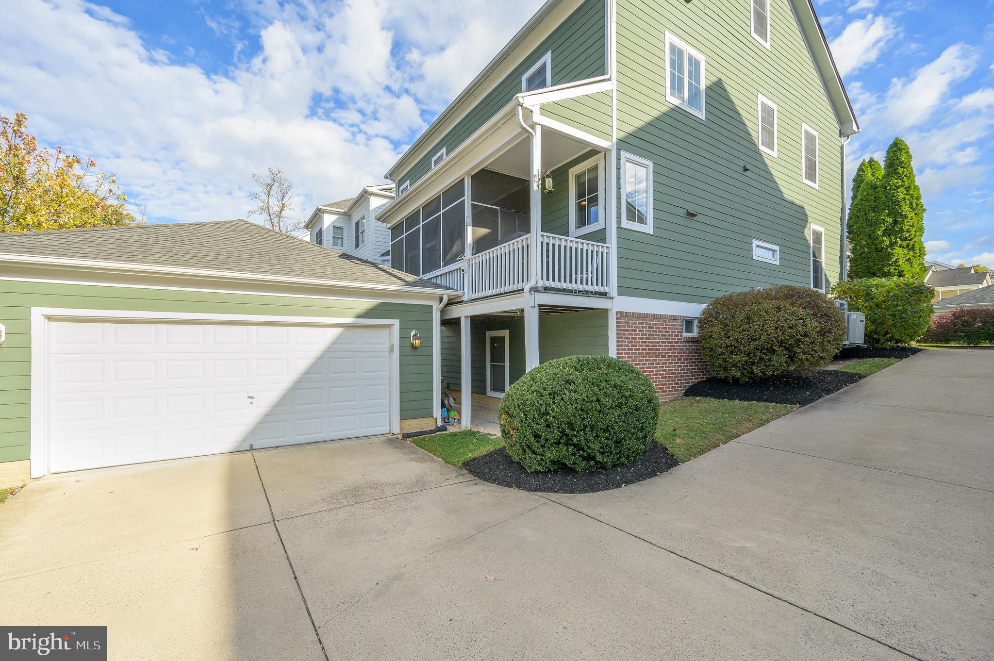 109 Amalfi Court Purcellville, VA 20132 - Photo 63 of 65 a front view of a house with a garden