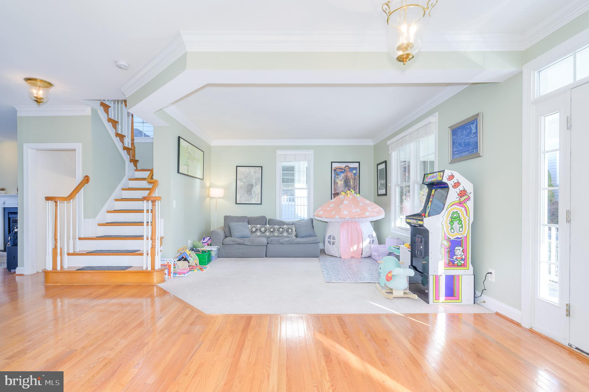 109 Amalfi Court Purcellville, VA 20132 - Photo 7 of 65 a living room with furniture and a wooden floor