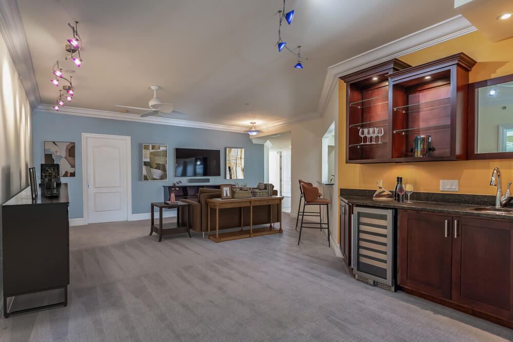 2240 Front Street, Unit 103 Melbourne, FL 32901 - Photo 12 of 37 a view of kitchen with sink microwave and cabinets
