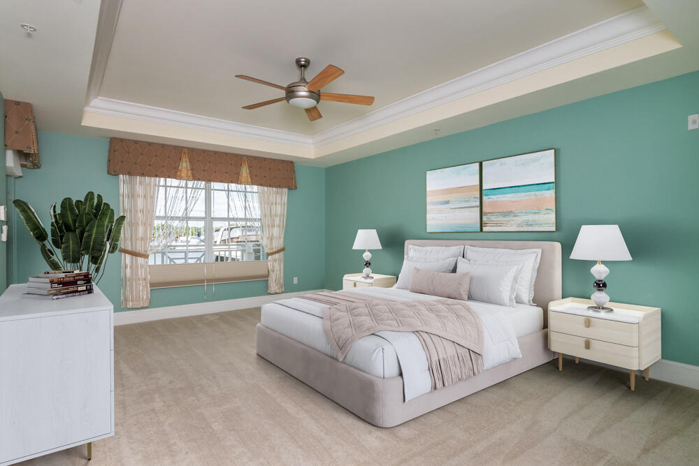 2240 Front Street, Unit 103 Melbourne, FL 32901 - Photo 15 of 37 a bedroom with a bed and a chandelier