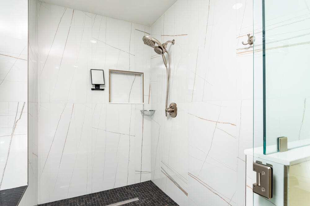 2240 Front Street, Unit 103 Melbourne, FL 32901 - Photo 18 of 37 a bathroom with a shower