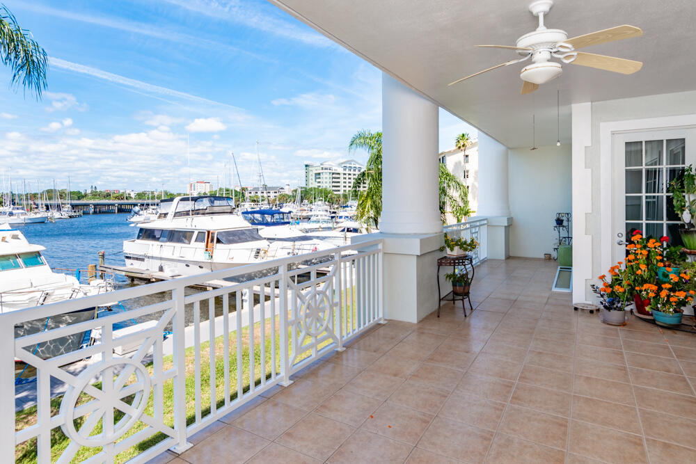 2240 Front Street, Unit 103 Melbourne, FL 32901 - Photo 24 of 37 a view of a chairs and table in a balcony