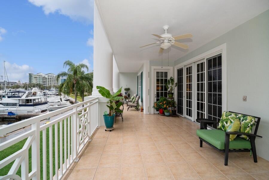 2240 Front Street, Unit 103 Melbourne, FL 32901 - Photo 27 of 37 a view of a porch with furniture and a potted plant
