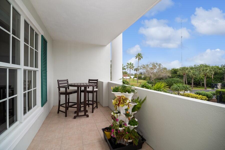 2240 Front Street, Unit 103 Melbourne, FL 32901 - Photo 28 of 37 a view of a chairs and table in the balcony
