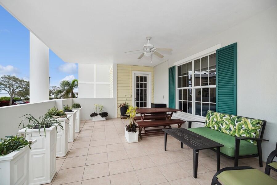 2240 Front Street, Unit 103 Melbourne, FL 32901 - Photo 29 of 37 a living room with furniture and a potted plant