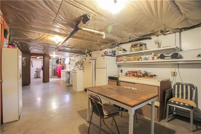 3425 Buck Road Clarksville, TN 37043 - Photo 20 of 20 basement with workshop room in rear left. laundry area and additional built ins