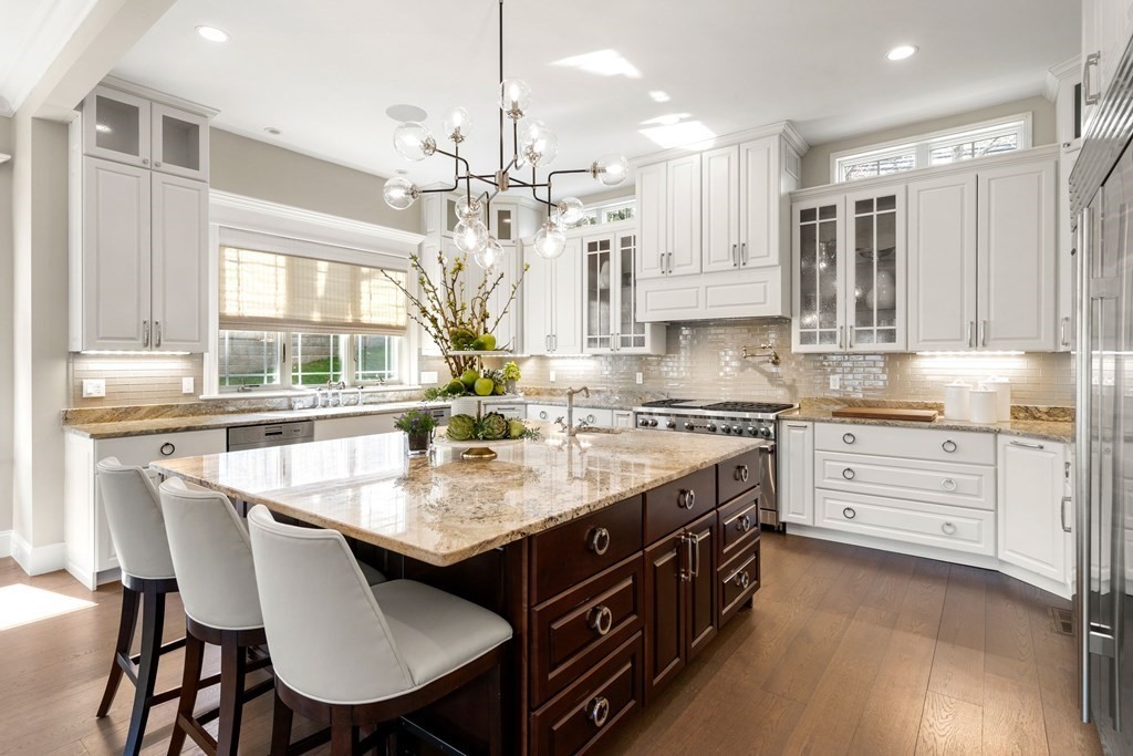 9 Nardell Road Newton, MA 02459 - Photo 2 of 32 a kitchen with stainless steel appliances kitchen island granite countertop a stove a sink and a refrigerator
