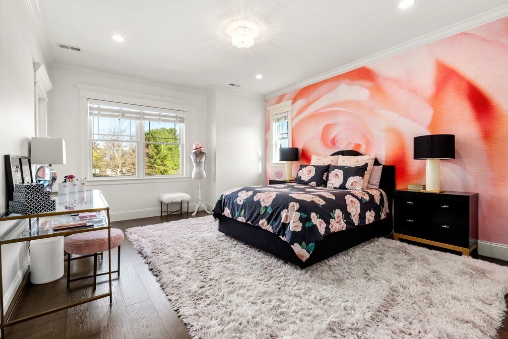 9 Nardell Road Newton, MA 02459 - Photo 24 of 32 a bedroom with a large bed and wooden floor