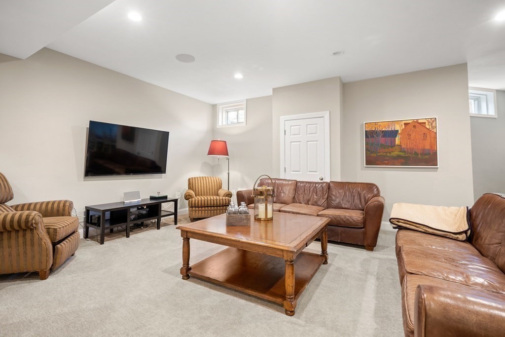 9 Nardell Road Newton, MA 02459 - Photo 27 of 32 a living room with furniture and a flat screen tv