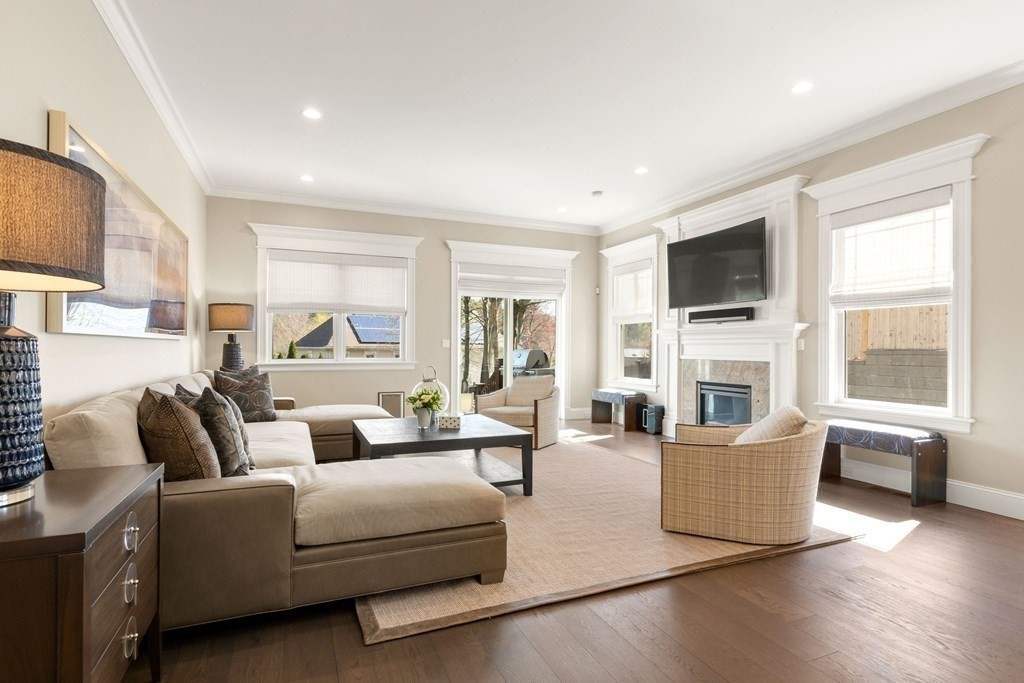 9 Nardell Road Newton, MA 02459 - Photo 9 of 32 a living room with furniture a fireplace and a flat screen tv