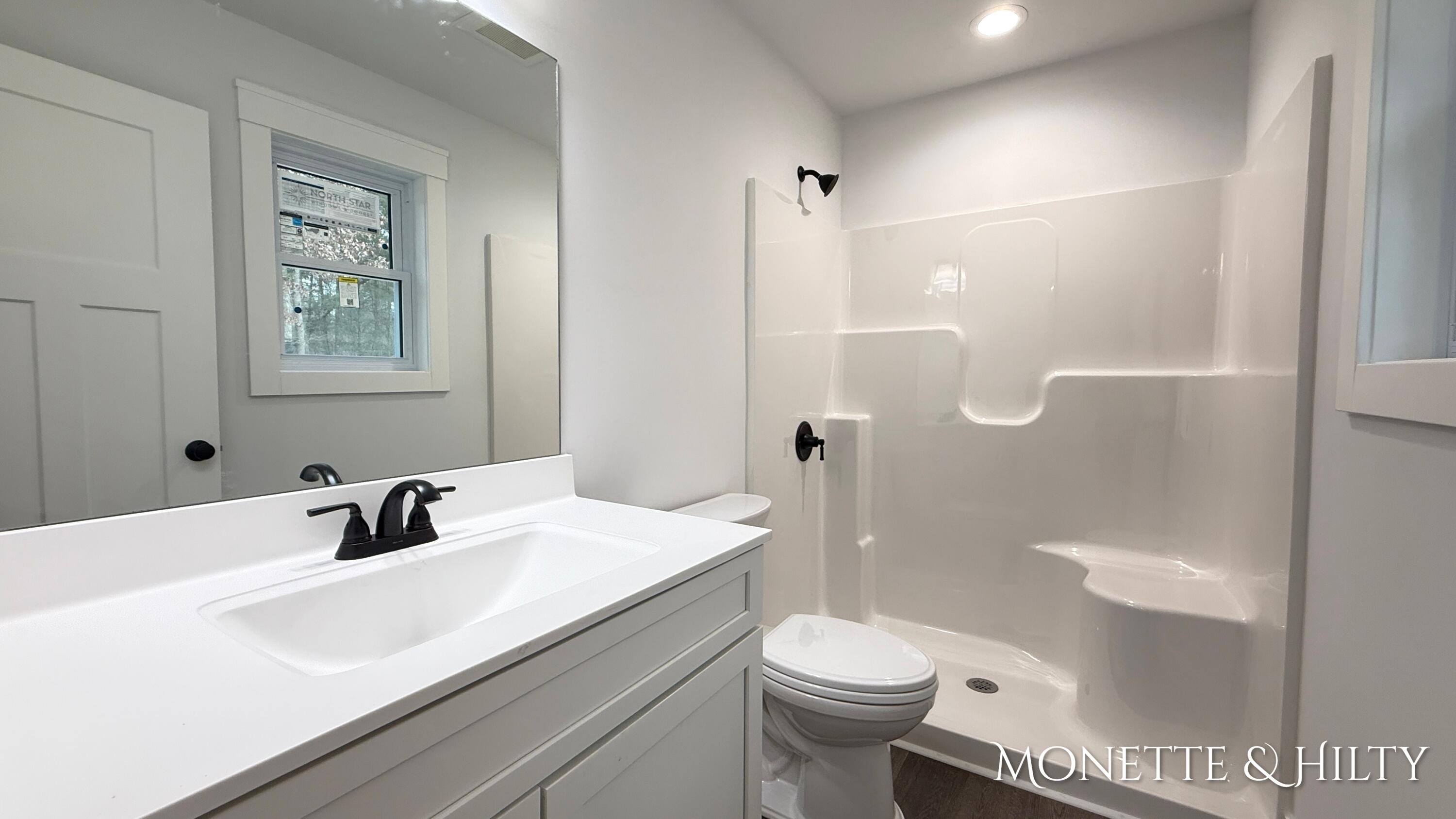 3318 East Michillinda Road Twin Lake, MI 49457 - Photo 13 of 26 Primary Bathroom