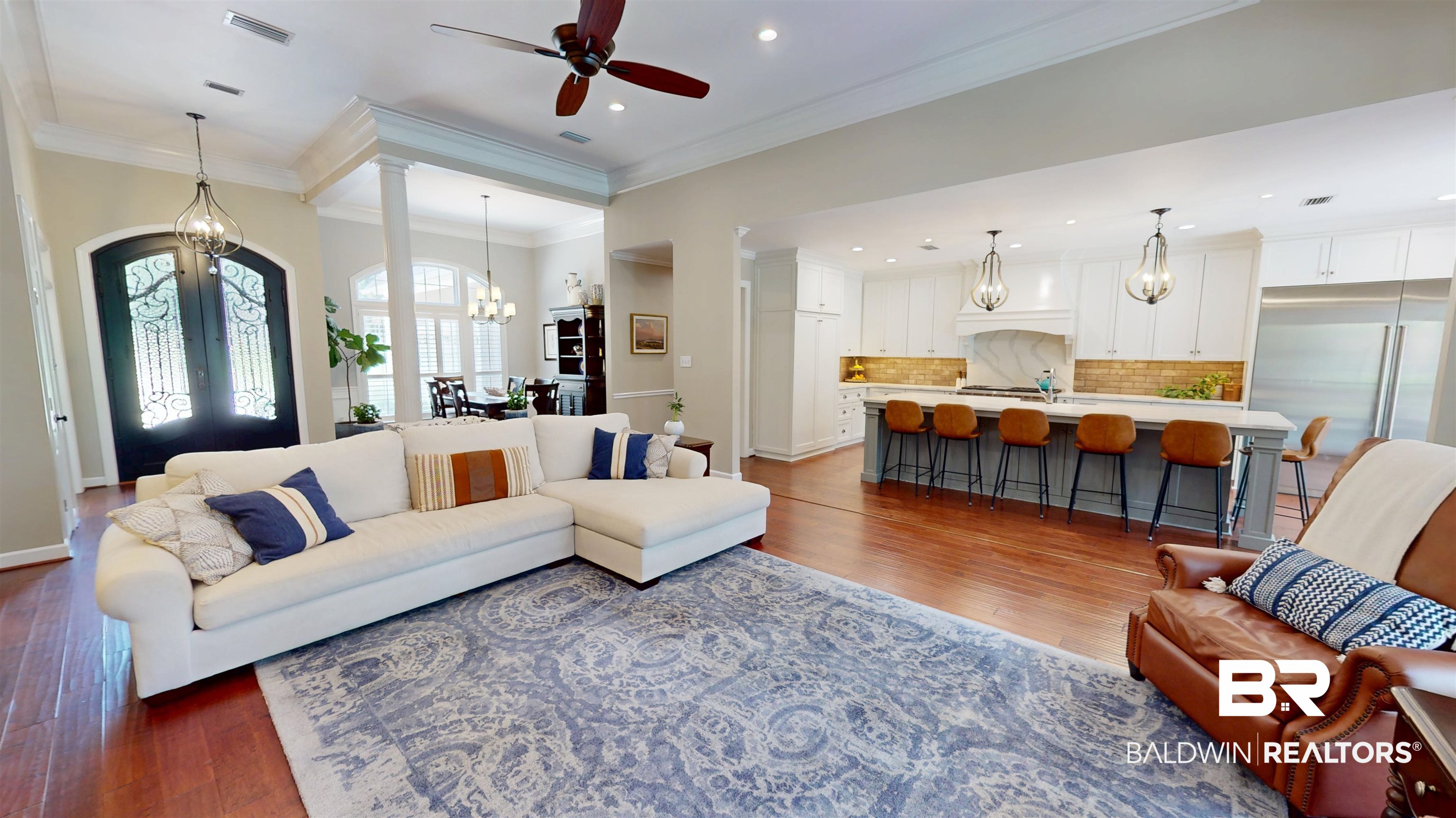 8775 Dawes Lake Road North Mobile, AL 36619 - Photo 21 of 59 Living area with crown molding, a chandelier, a ceiling fan, dark wood-style floors, and french doors