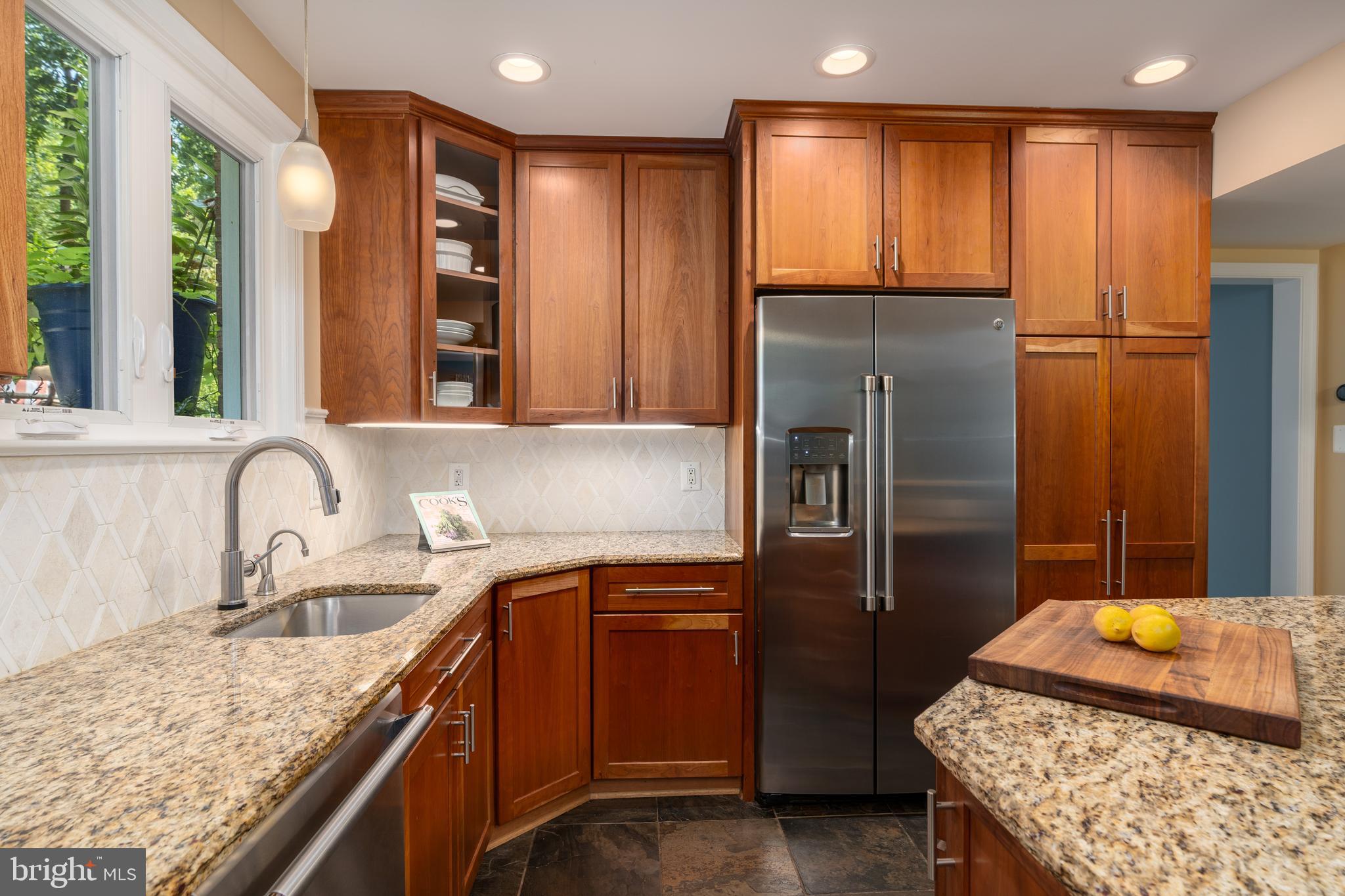 7303 Fort Hunt Road Alexandria, VA 22307 - Photo 2 of 9 a kitchen with stainless steel appliances granite countertop a refrigerator and a sink