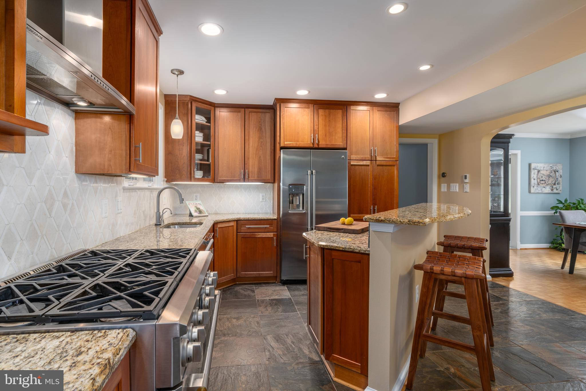 7303 Fort Hunt Road Alexandria, VA 22307 - Photo 3 of 9 a kitchen that has a lot of cabinets in it and wooden floors
