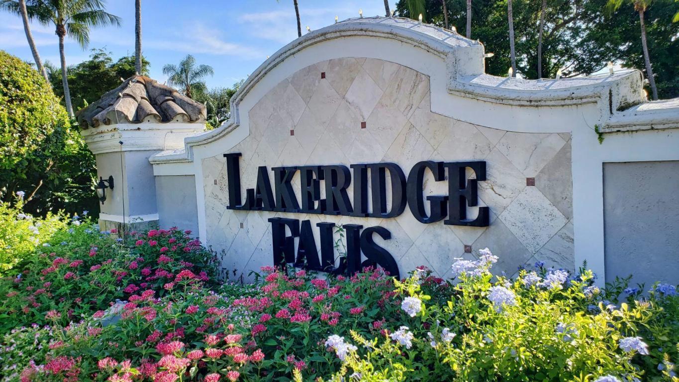 7386 Falls Road East Boynton Beach, FL 33437 - Photo 2 of 32 Entry Sign
