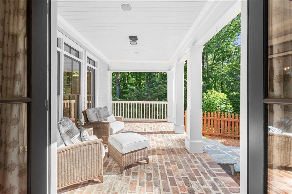 1450 Acworth Due West Road Northwest Kennesaw, GA 30152 - Photo 56 of 77 a porch with a couch next to a yard