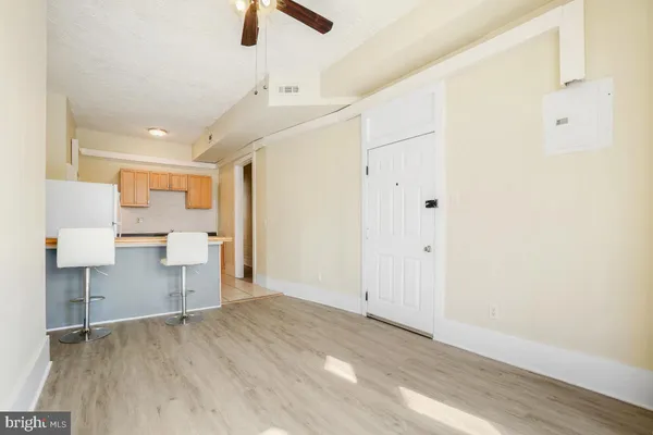 a kitchen with a sink a counter top space and cabinets