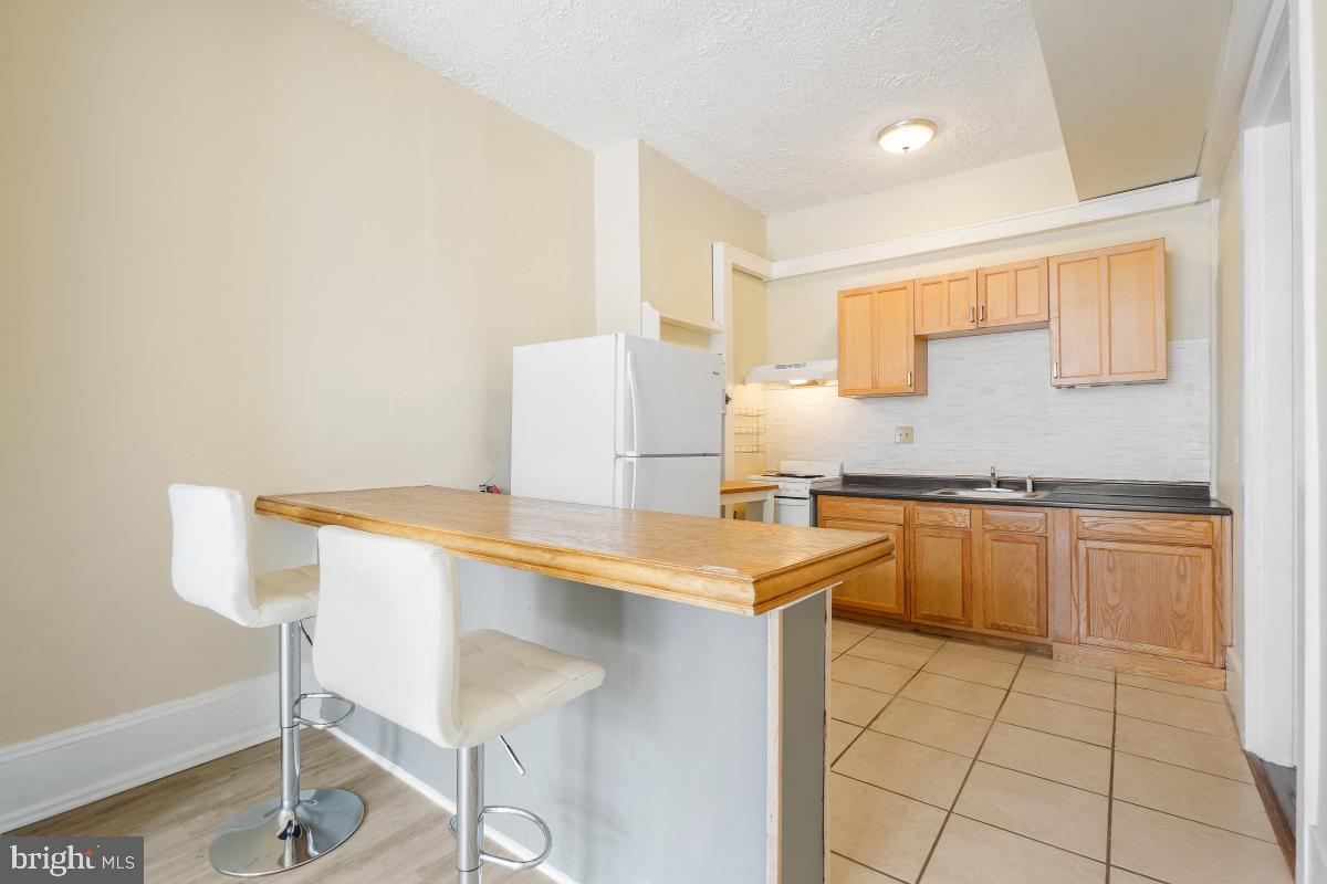 471 Florida Avenue Northwest, Unit 1 Washington, DC 20001 - Photo 12 of 39 a kitchen with a sink a counter top space and cabinets