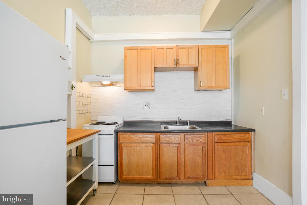 471 Florida Avenue Northwest, Unit 1 Washington, DC 20001 - Photo 18 of 39 a kitchen with a sink and cabinets
