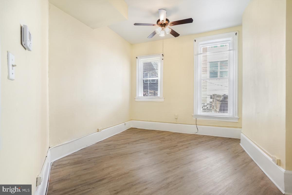 471 Florida Avenue Northwest, Unit 1 Washington, DC 20001 - Photo 25 of 39 a view of empty room with wooden floor and fan